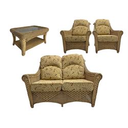 Four piece cane conservatory suite - two seat sofa (W130cm), pair of armchairs (W85cm), and coffee table (85cm x 60cm)