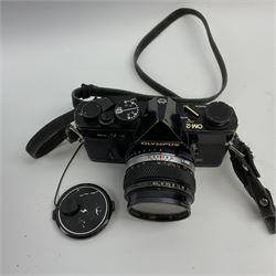 Olympus OM2 camera, 'no.264258', fitted with Olympus 'OM System G.Zuiko Auto-W 1:2.8 f35mm' lens and two other lenses, in a carry case