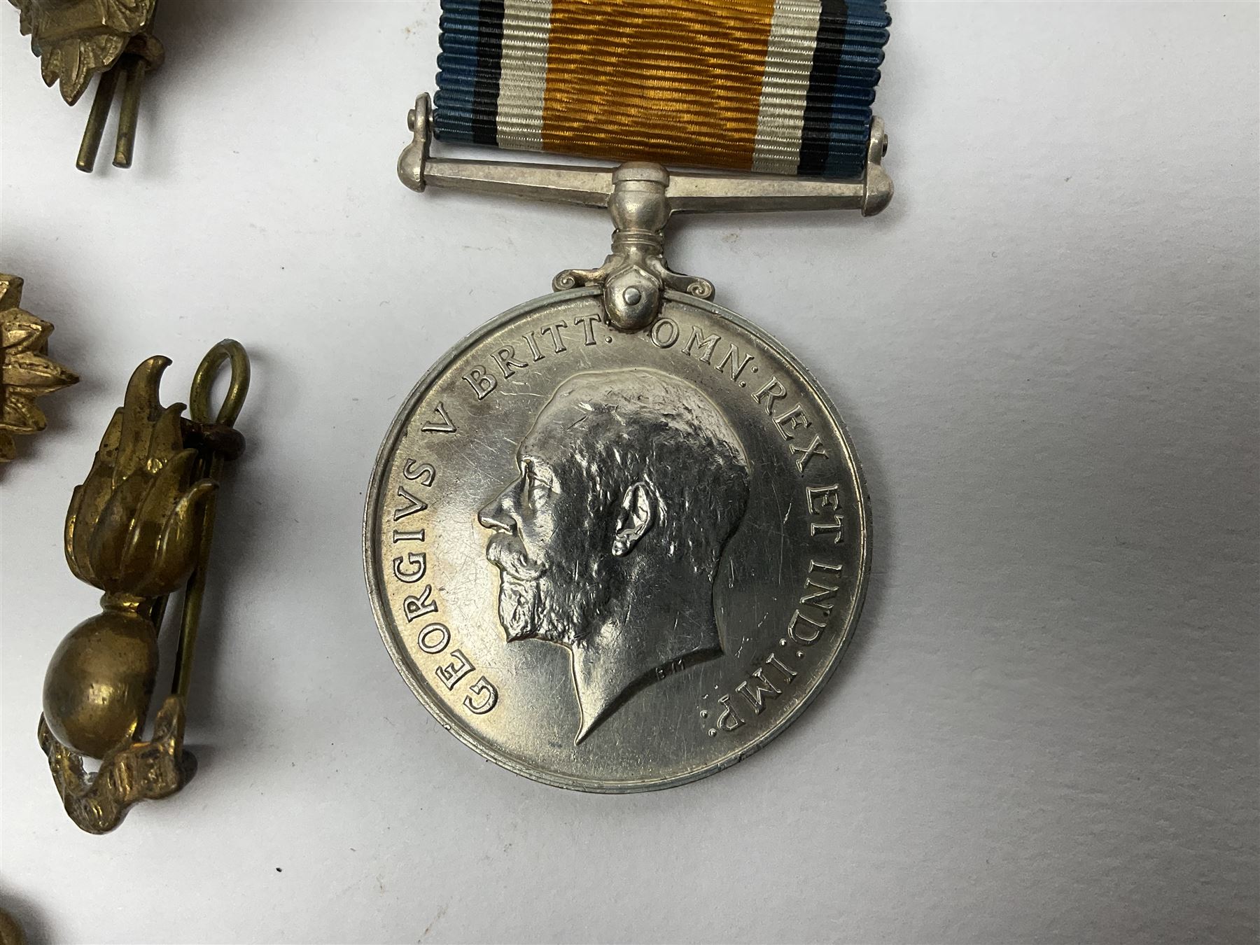 WW2 German Luftwaffe Mess cutlery comprising table spoon and fork, each with H.M.Z.38 mark; WW1 British War Medal awarded to L-13858 Gnr. J. McCabe R.A.; and small quantity of military badges, rank pips etc