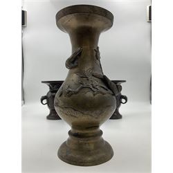 Chinese bronze vase, of baluster form with elongated neck, decorated in relief with birds amongst prunus blossom, together with a smaller pair of twin handled bronzed vases, decorated with peacocks and a blue Peking glass dish, with white metal mounted decorated with dragons, bronze vase H23.3cm