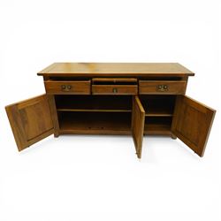 Barker & Stonehouse - 'New Frontier' mangowood wide sideboard, rectangular top with a central brushing slide above a drawer, flanked either side by a drawer, above three cupboard doors, raised on stiled supports