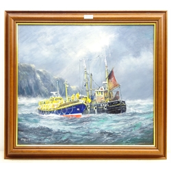  Jack Rigg (British 1927-): 'Helpmates' - Whitby Lifeboat alongside a Berwick Fishing Boat, oil on canvas signed and dated 2008, titled verso  50cm x 59cm  DDS - Artist's resale rights may apply to this lot  