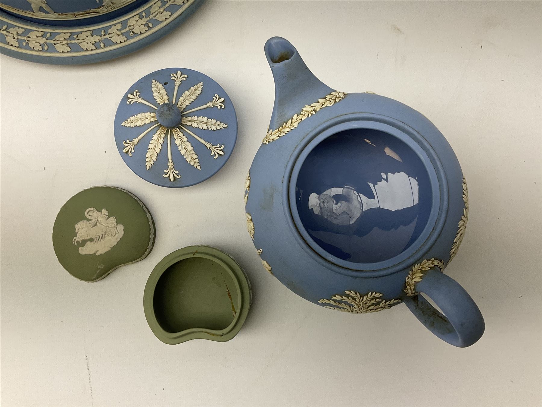 Late 19th century pale blue Wedgwood Jasperware cheese dome with cover, decorated with acorn and oak leaf bands surrounding neo-classical ladies, cherubs, flowers and trees, impressed Wedgwood mark beneath, together with further Wedgwood Jasperware teapots, boxed dishes etc