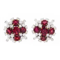 Pair of 18ct white and yellow gold Burmese ruby and diamond stud earrings, each cluster with five oval and round cut rubies and round brilliant cut and tapered baguette cut diamonds, total ruby weight approx 3.40 carat, total diamond weight approx 2.25 carat, in fitted box by Licht & Morrison, London