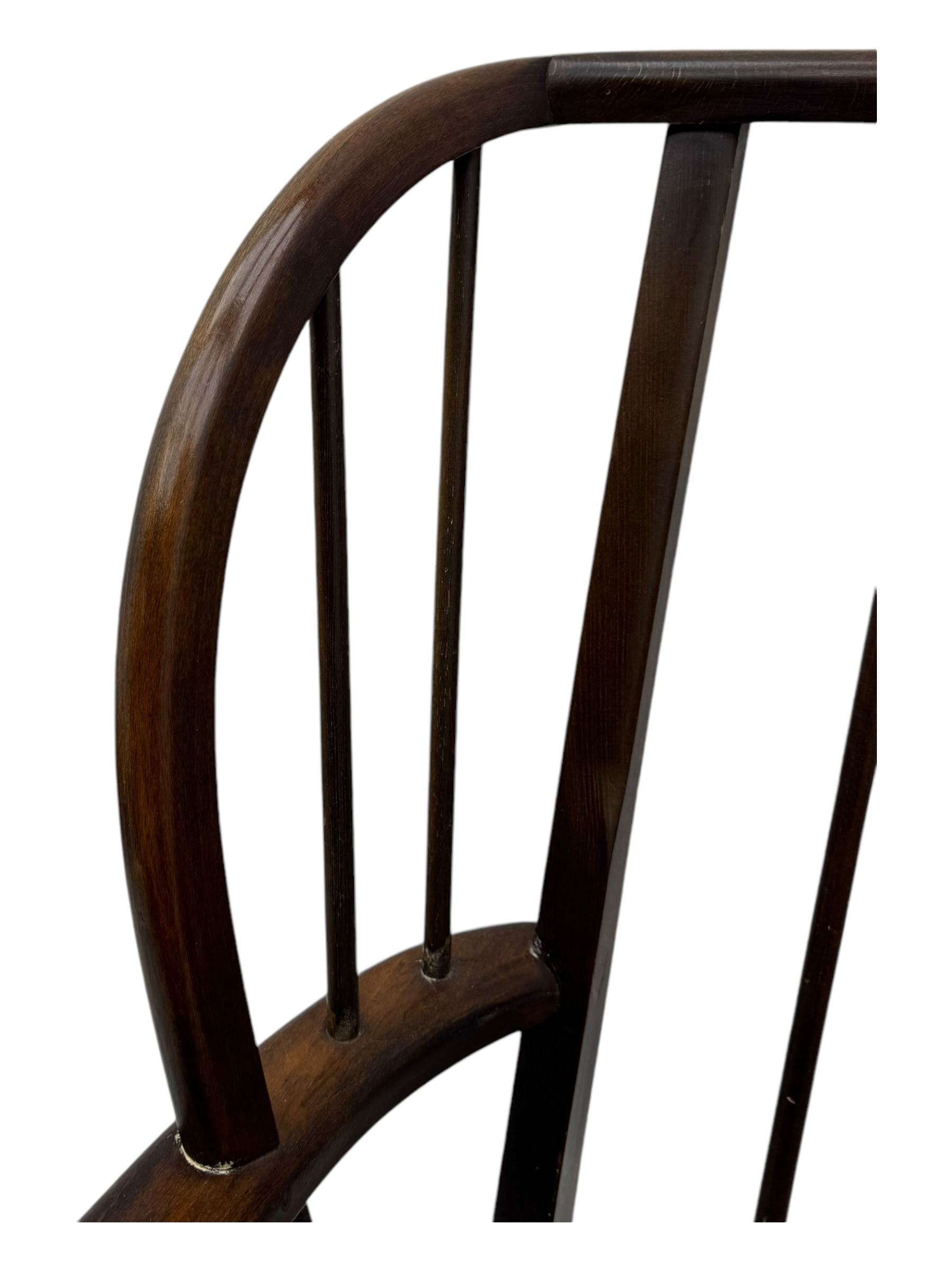 Joynson Holland - pair of mid-20th century stained beech framed easy chairs, shaped back and flat armrests over floral tapestry cushioned seat and back, on splayed supports united by stretcher