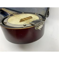Dulcet eight-string banjo mandolin with mother-of-pearl inlaid ebonised fingerboard L55.5cm; cased; and Irish mahogany bodhran hand drum with inlaid stringing and vellum top D46.5cm; in soft carrying case with double ended beater (2)