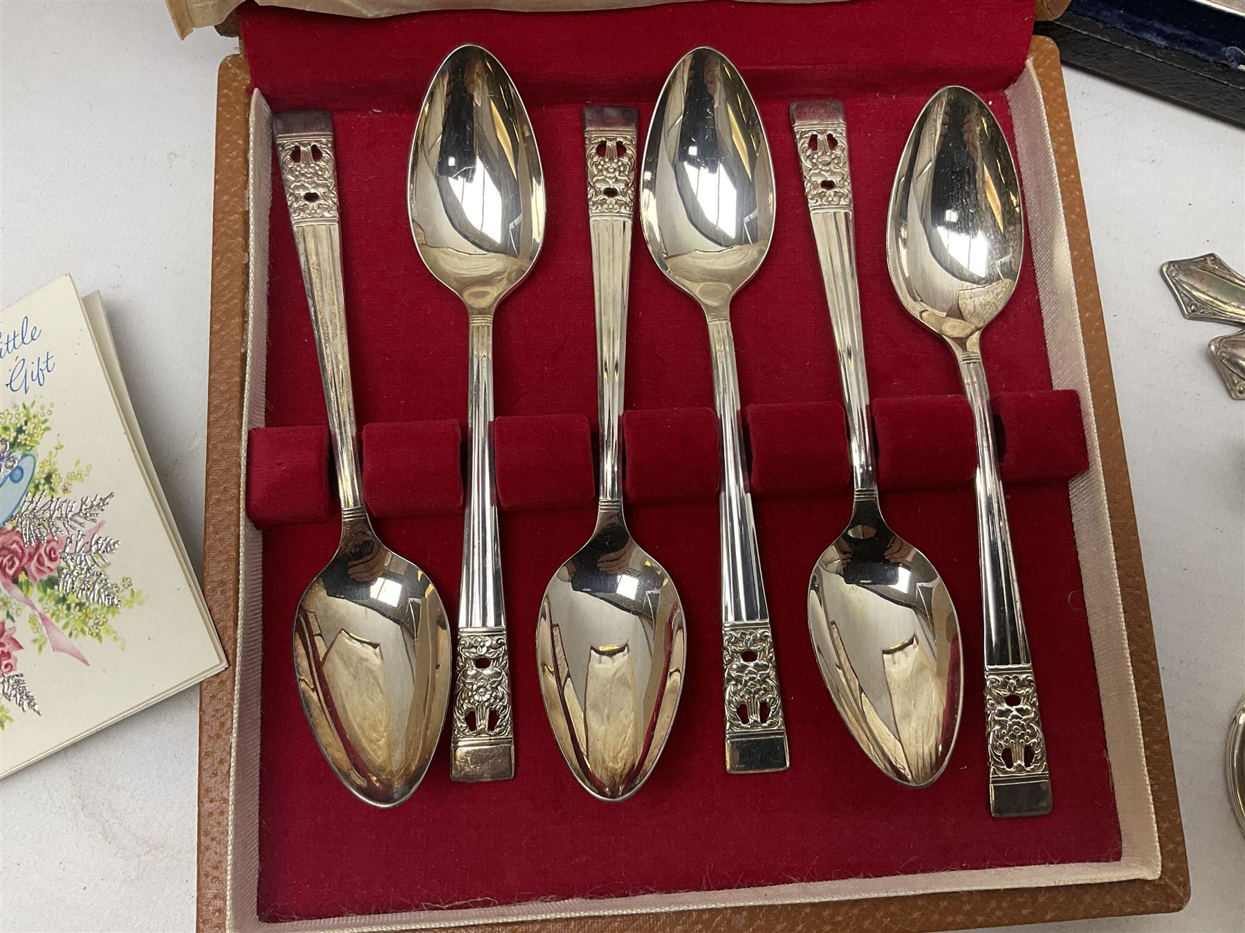 Group of silver to include cased set of six silver handled knives hallmarked Birmingham 1921 by Raeno Silver Plate Co, three hallmarked napkin rings etc together with silver plated and other metalware etc