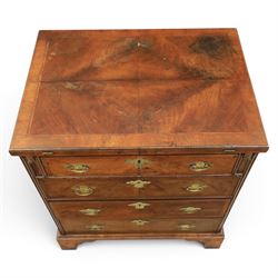 Early 20th century Georgian design figured walnut bachelor's chest, with half fold over top and lopers, over three drawers with pierced brass handles and escutcheons 
