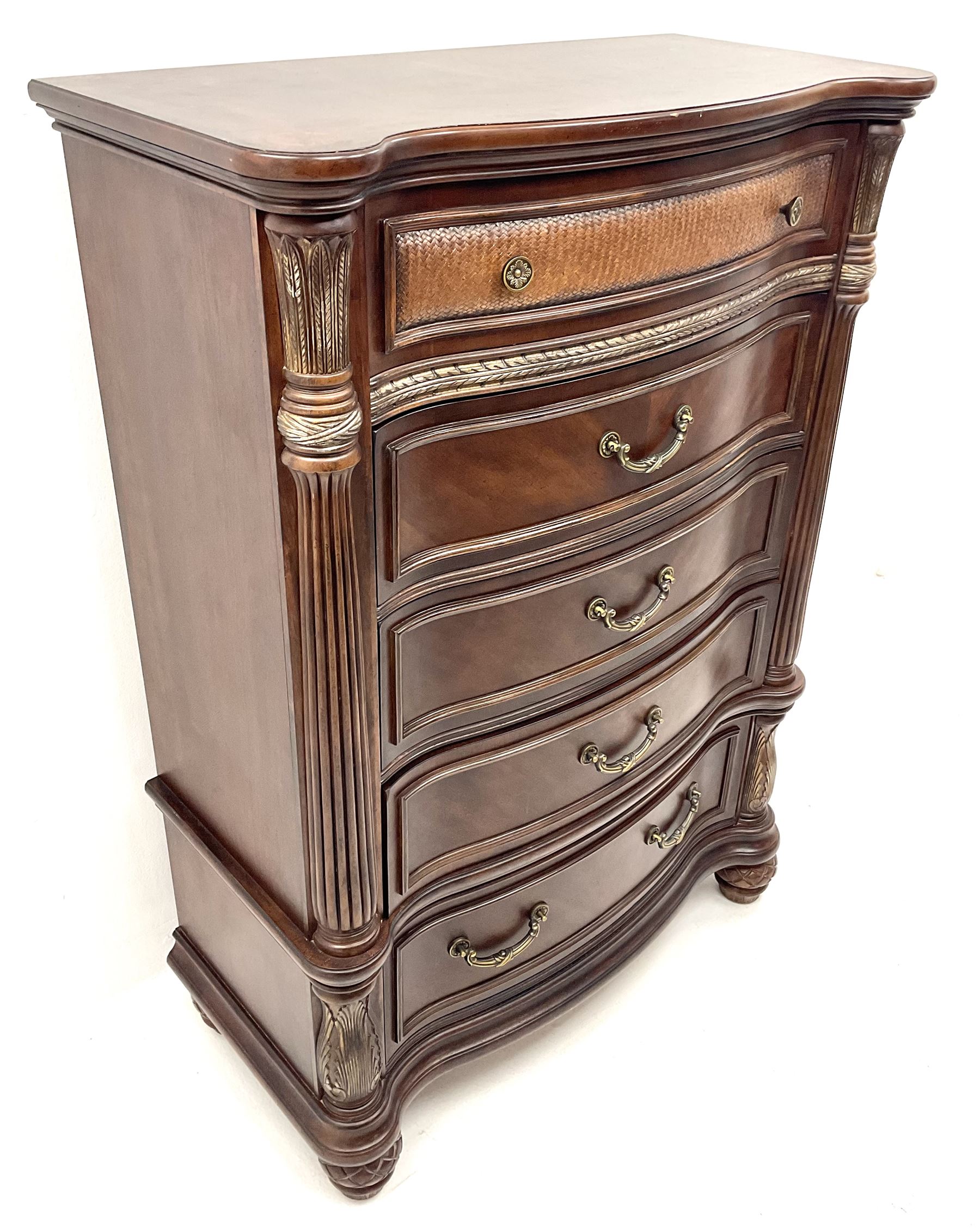 Kevin Charles American walnut serpentine chest, five graduating drawers, half turned fluted column carving, turned supports 
