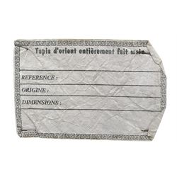 Persian design ivory ground rug, overall floral design with shaped central medallion, the main border decorated with trailing flower head pattern, within guard stipes 