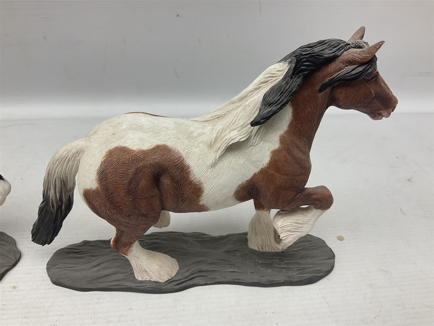 Seven Border Fine Arts figures, comprising Clydesdale Mare & Foal A0187, Highland Mare & Foal A2691 and five horses from the Action Horses series 