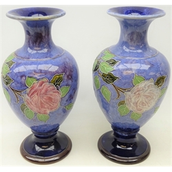  Pair early 20th century Royal Doulton stoneware baluster vases decorated with tube-lined roses, by Bessie Newbery, impressed L.B 635, H35cm   