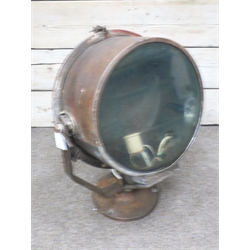  GEC Searchlight, circular body with 44cm dia. clear glass lens, on angular supports and cast circular base, H80cm,   