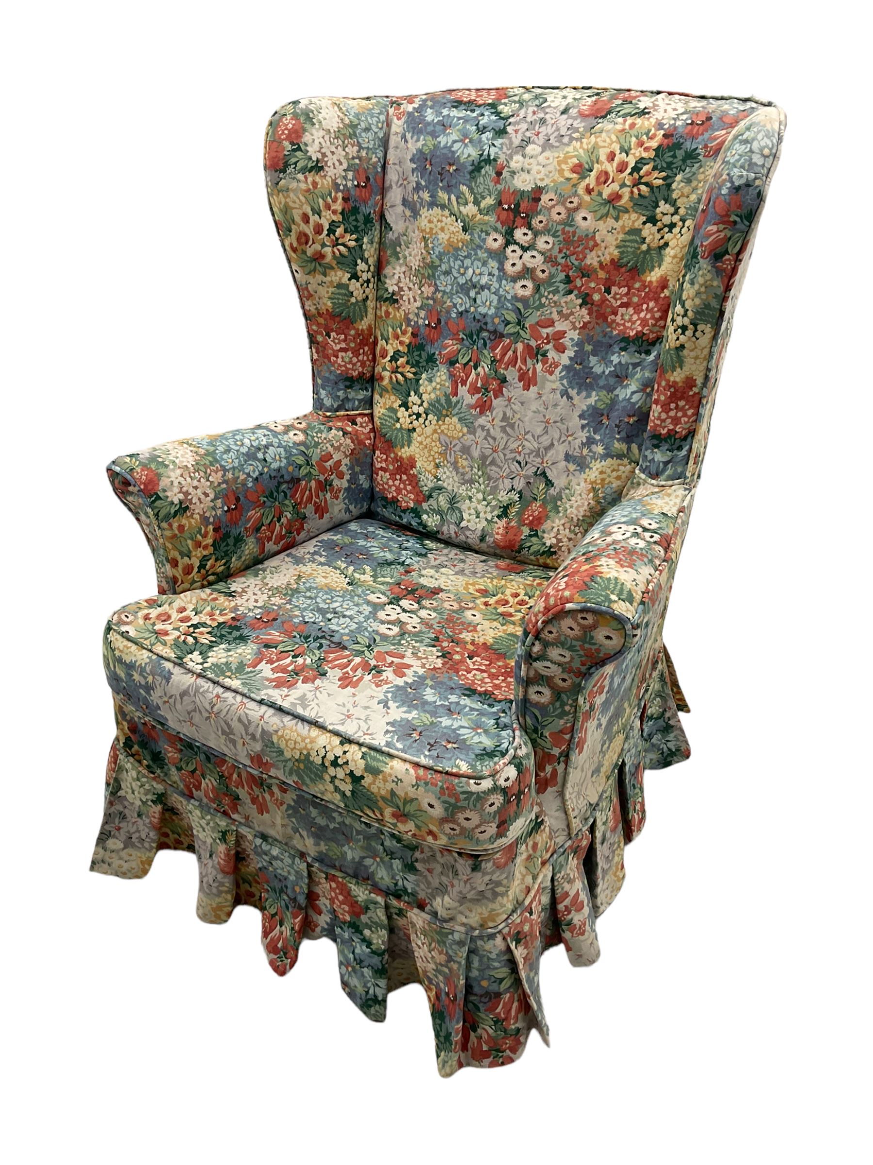 Vintage Parker Knoll wingback armchair with floral chintz fitted cover