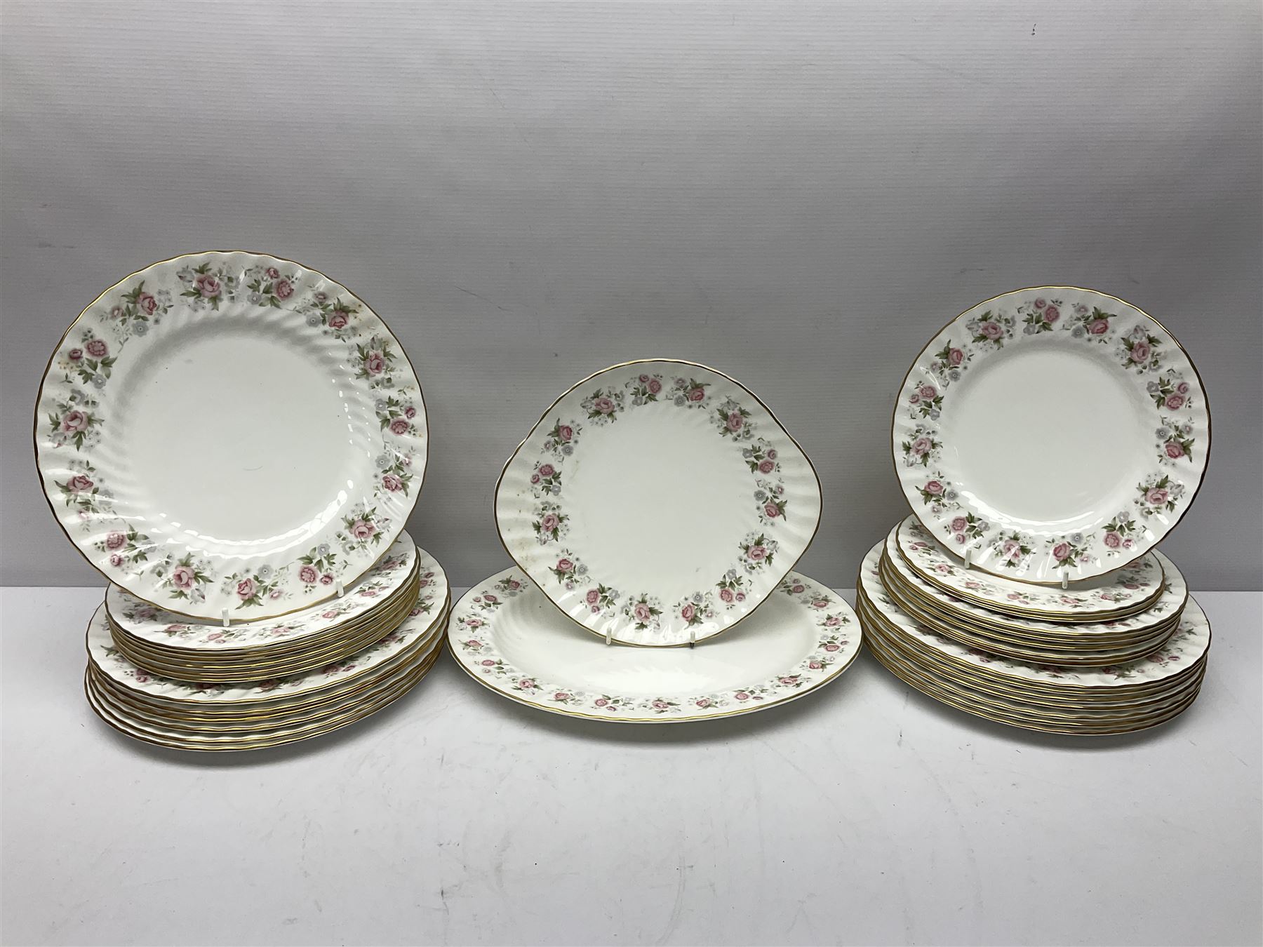 Minton Spring Bouquet pattern dinner and tea service, comprising dinner plates, twin handled tureens with covers, meat platter, teapot, milk jug, sugar bowl with cover, tea cups and saucers, bowls, cake plate, side plates, dessert plates, etc all with printed mark beneath (82)