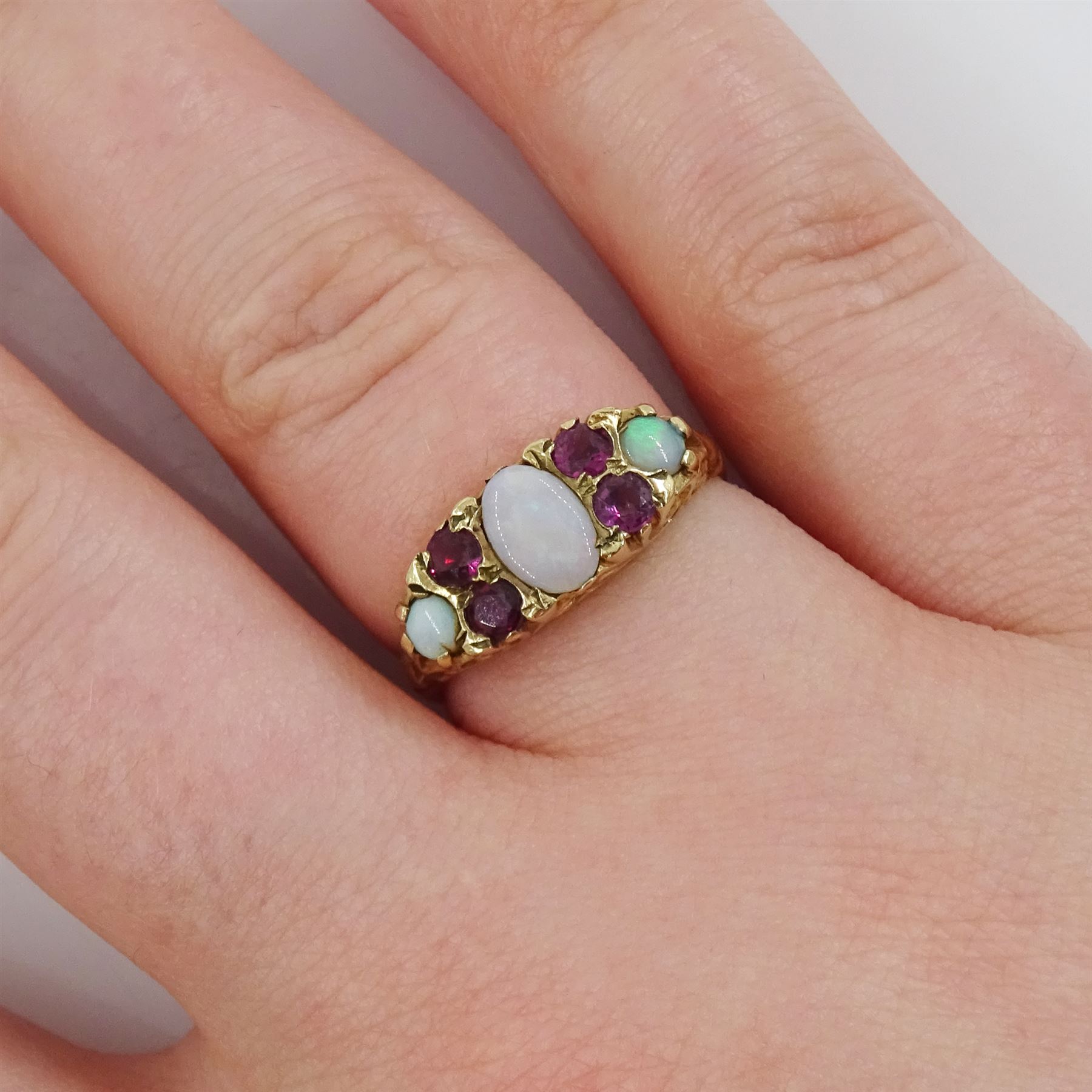 9ct gold three stone opal and four stone ruby ring, Birmingham 1976