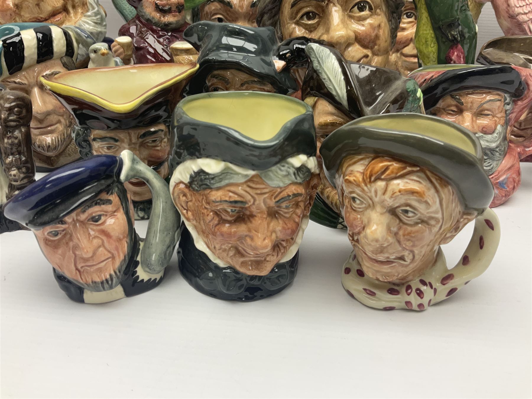 Twenty two Royal Doulton toby and character jugs, including Ugly Duchess D6599, Old Salt D6551, The Walrus & Carpenter D6600, Robin Hood D6534