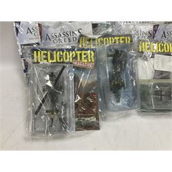 Fifteen Amer Czechoslovakia periodical issued metal models of helicopters each in unopened original packaging with copy of 'Helicopter Magazine'; together with seven unopened Hachette 'Assassin's Creed' periodical figures with magazines (22)