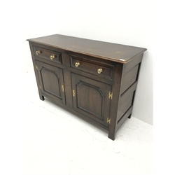 Early 20th century Georgian style oak dresser base, two cupboards with fielded panels and  two drawers above, W137cm, H92cm, D51cm