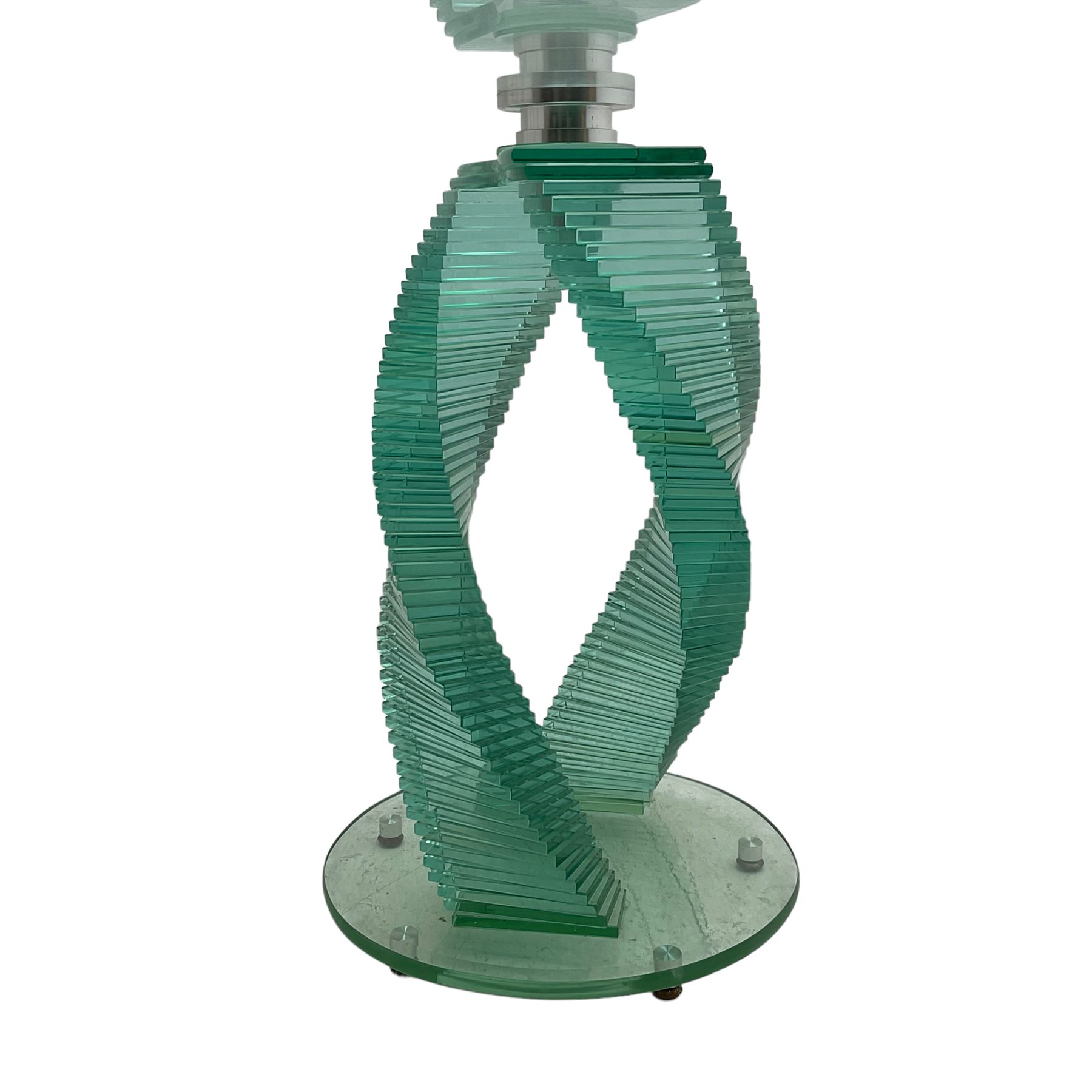 Contemporary sculptural glass table, on stacked twist base, bevelled circular top