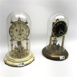Late 20th century Kundo anniversary clock, Arabic dial, cream painted and decorated with flowers and another late 20th century anniversary clock with black dial, both under glass domes