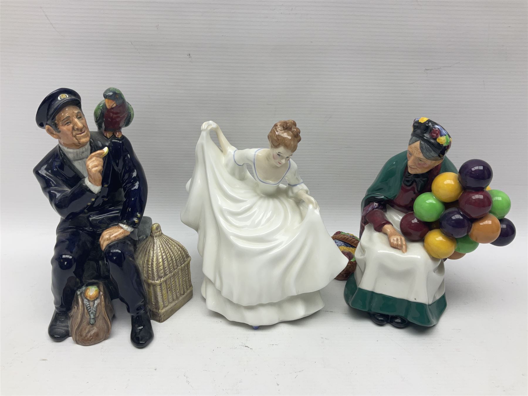 Five Royal Doulton figures, including Shore Leave HN2254, The Old Balloon Seller HN1315, Rose HN1348 etc, together with Royal Worcester Coquette