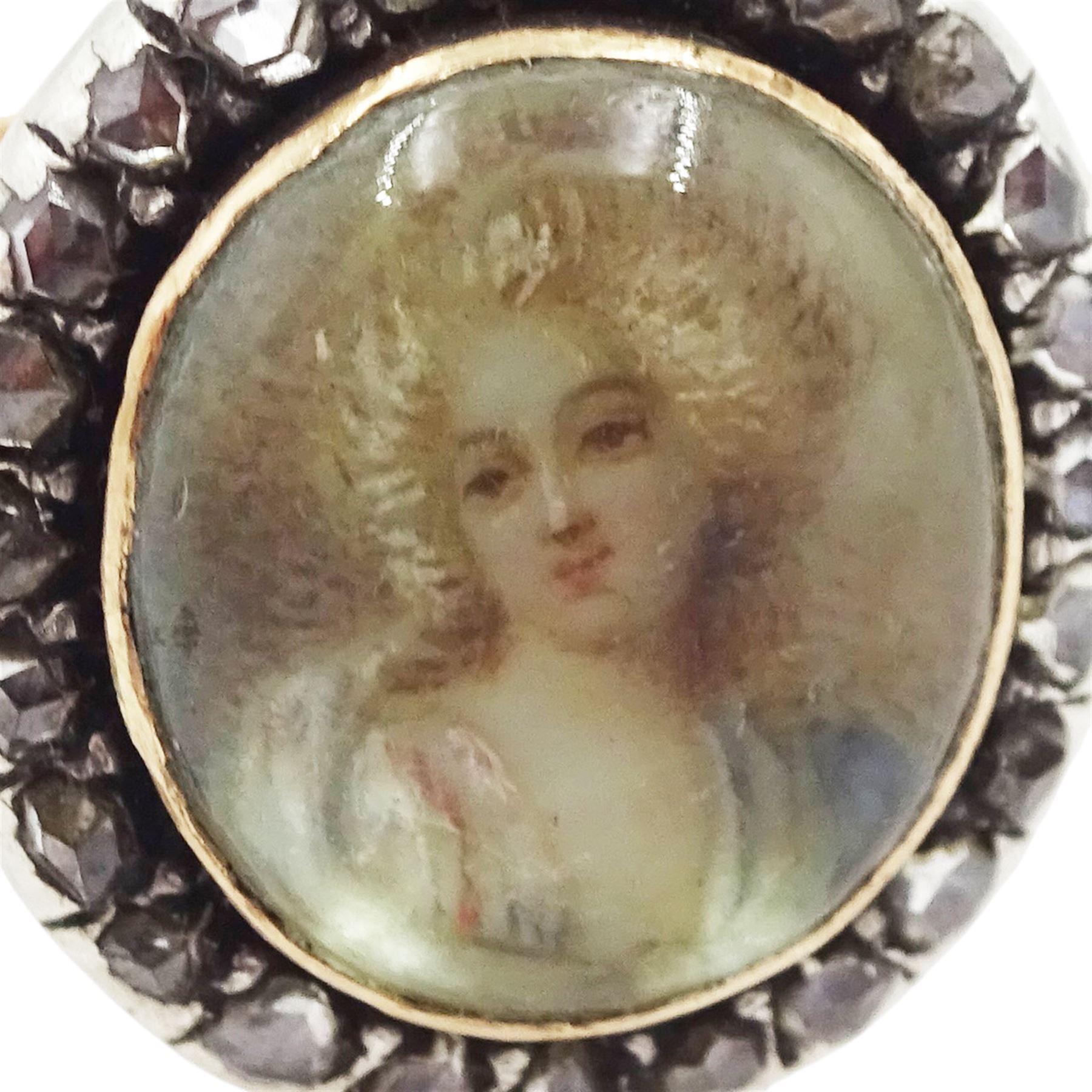 19th century French 18ct gold and silver diamond portrait ring, set with an oval miniature of a woman in 18th century dress on ivory, under a glazed panel, with rose cut diamond surround and trifurcated shoulders, hallmarked. This lot has been registered for sale under Section 10 of the APHA Ivory Act