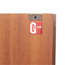 G Plan - 'Fresco' teak double wardrobe, twin doors enclosing a single clothes rail, on a recessed plinth base with castors beneath  