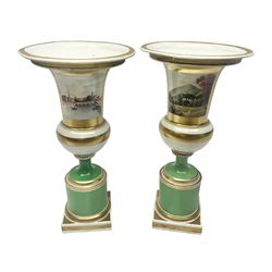 Pair of Worcester pedestal vases, probably Grainger & Co, each painted with views of Worcester and Malvern against a green ground with gilt bands, each titled beneath, H26cm
