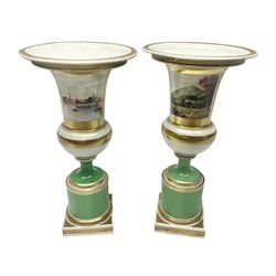  Pair of Worcester pedestal vases, probably Grainger & Co, each painted with views of Worcester and Malvern against a green ground with gilt bands, each titled beneath, H26cm
