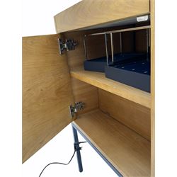 Light oak display case on stand, fitted with drawer and cupboard, illuminated