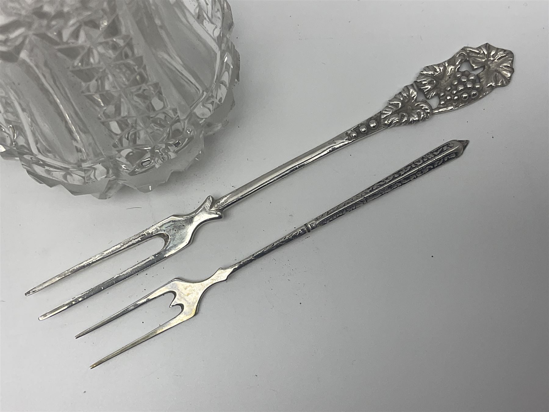 Early 20th century cut glass silver sugar caster, hallmarked C B Thomas & Co, Birmingham 1910, together with silver pepper, hallmarked, a continental silver pickle fork, stamped 800 and a plated cake fork