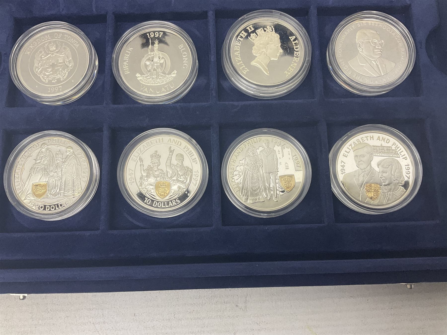 The Royal Mint Golden Wedding Anniversary silver proof coin collection, comprising twenty-four international commemorative coins, cased with certificates