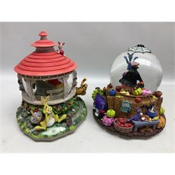 Six Disney Winnie The Pooh snow globes, to include four Halloween examples, including Tigger's Haunted House, together with Winnie The Pooh Gazebo snow globe and Bonfire snow globe, all with boxes