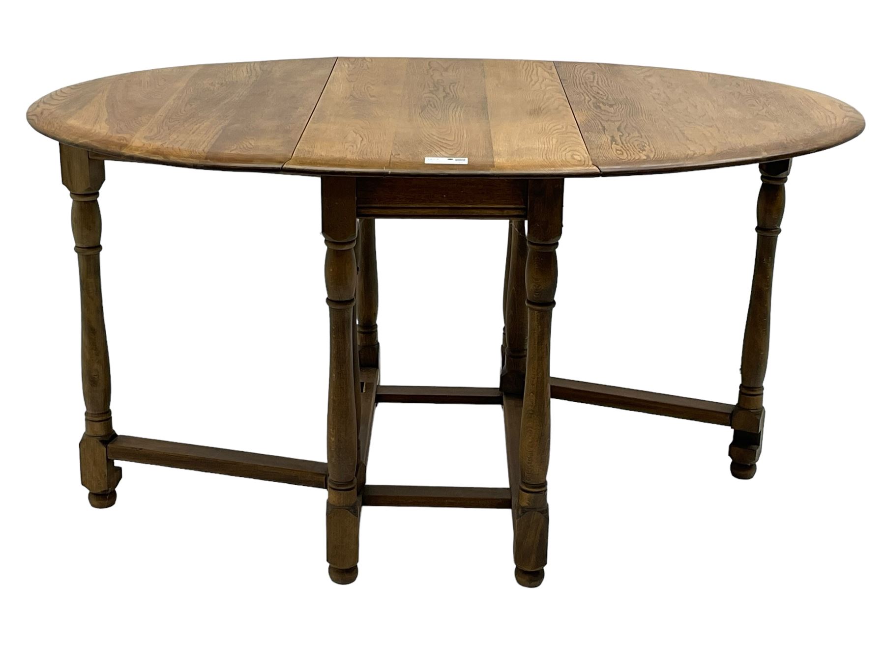Mid-to-late 20th century oak and beech drop-leaf dining table, gate-leg action base with turned supports