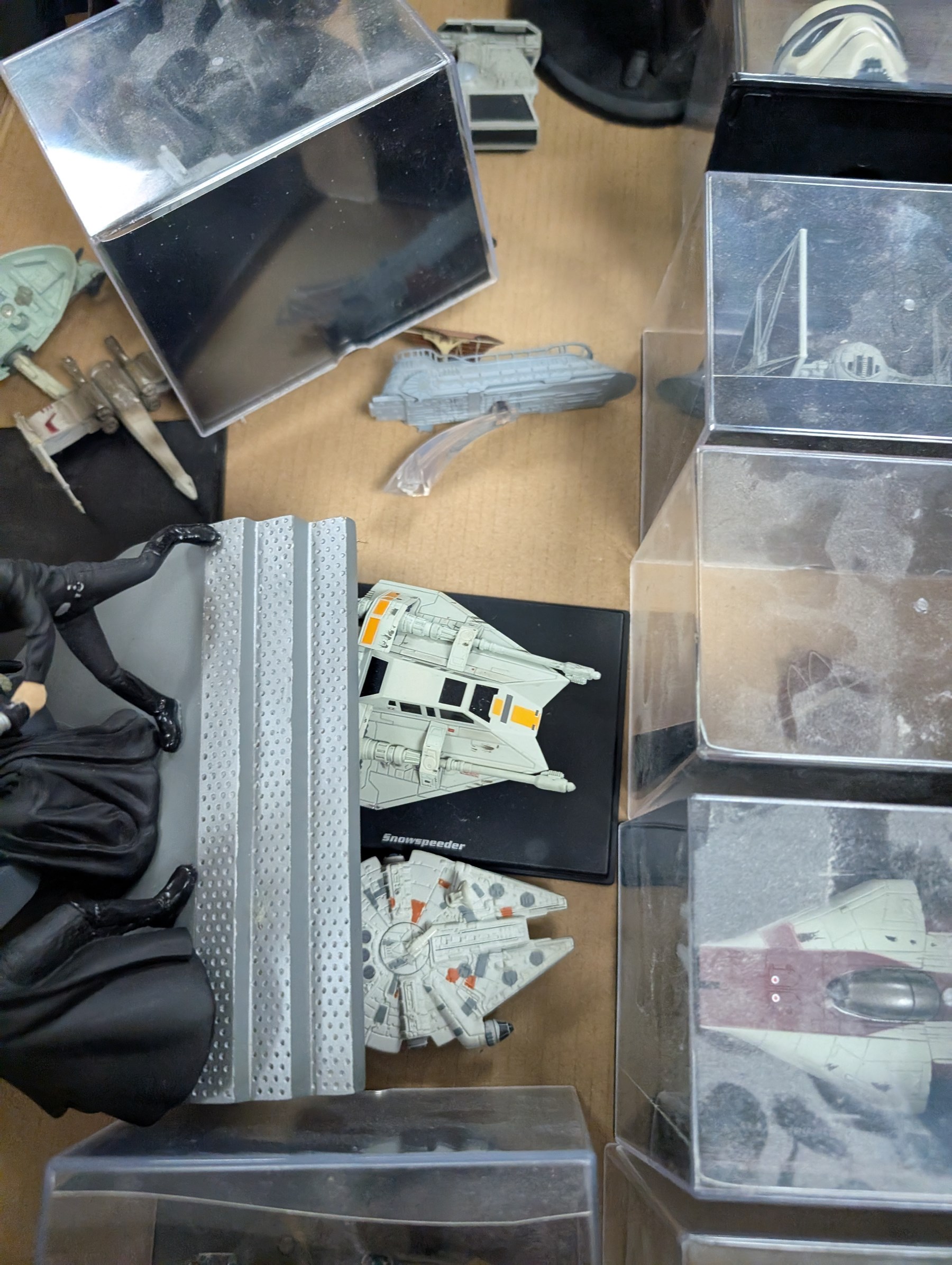 Collection of DeAgostini Star Wars figures, including two limited edition Darth Vader figures, diecast vehicles and figures and miniature helmets