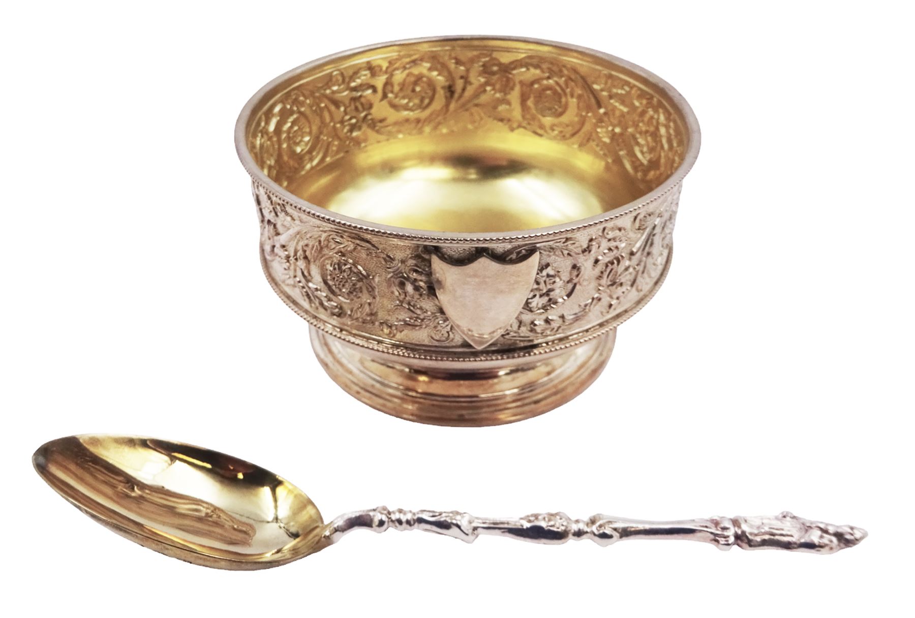 Victorian silver bowl, with embossed floral decoration and beaded rim, gilt interior and two applied shield cartouches, upon stepped circular foot, with a silver apostle spoon, with gilt bowl, both hallmarked George Unite, Birmingham 1883, bowl H5.5cm, within fitted tooled leather, silk lined case