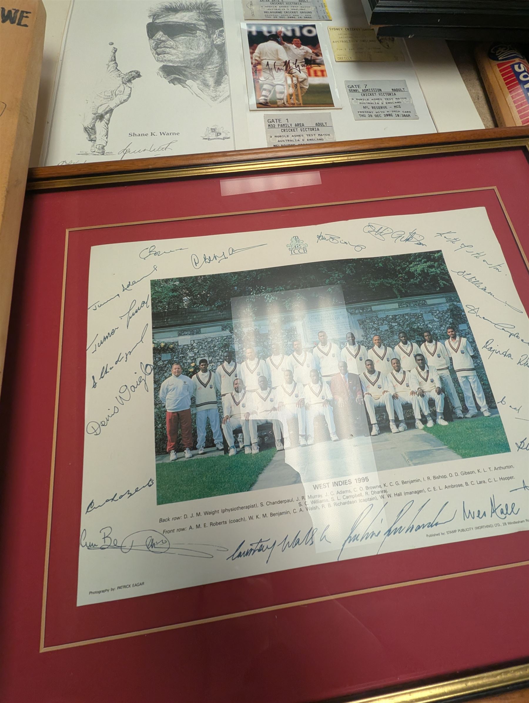 Collection of signed International cricket memorabilia, mostly relating to West Indies, including Curtly Ambrose and Brian Lara prints, Shane Warne and Glen McGrath last test souvenirs, signed Zimbabwe 2003 tour cricket bat, etc