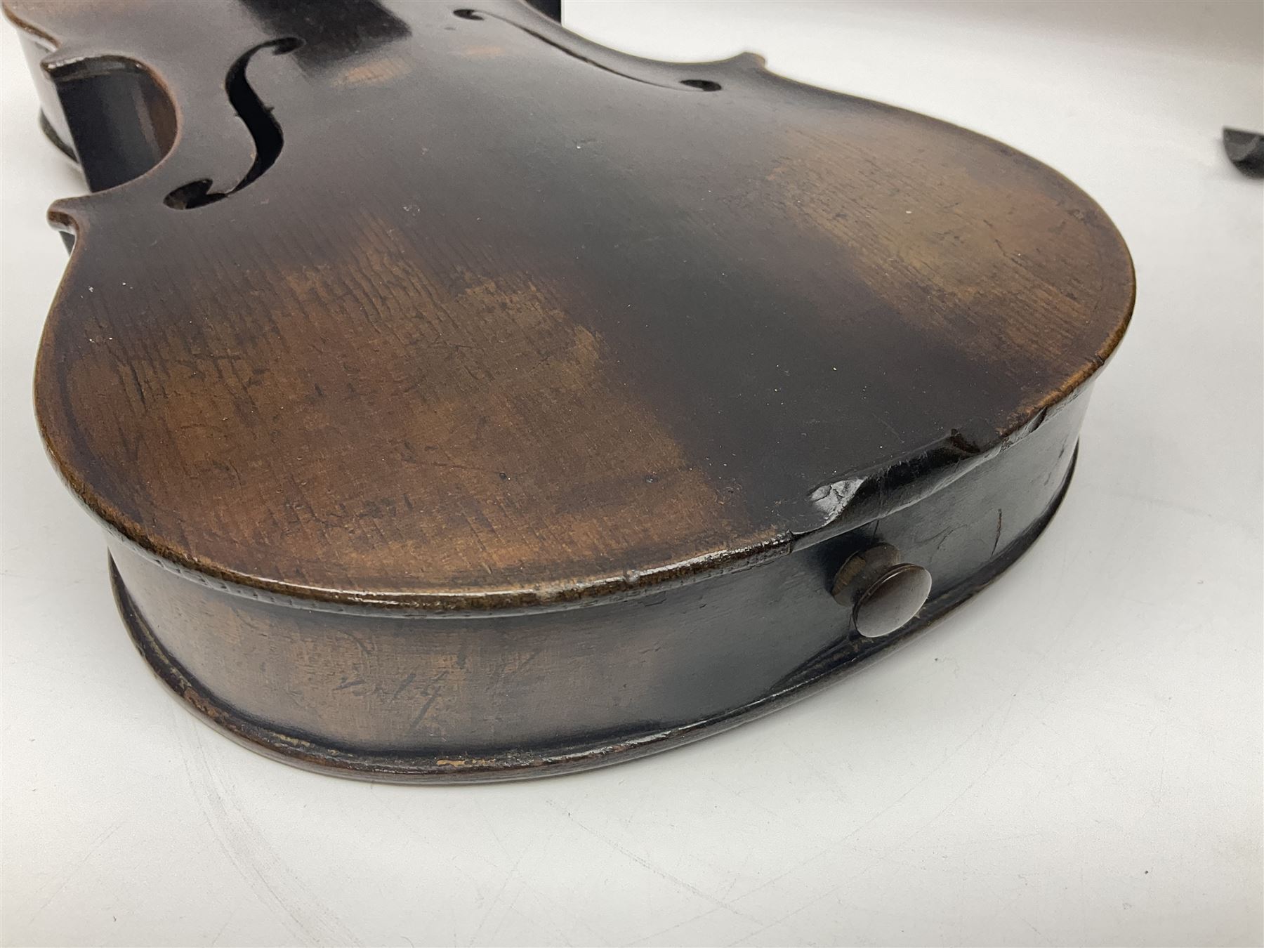 German violin c1890 with 36cm two-piece maple back and ribs and spruce top; bears label 'Antonius Stradivarius Cremona Faciebat Anno 1729' L59.5cm overall; in ebonised wooden 'coffin' case; and two German violins c1890 for completion - one bearing a Stradivarius label, the other a Ruggeri label; both in carrying cases (3)