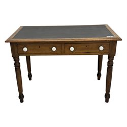 Victorian pine writing table, rectangular top with moulded edge and inset leather writing surface, the frieze fitted with two short drawers, raised by turned supports 