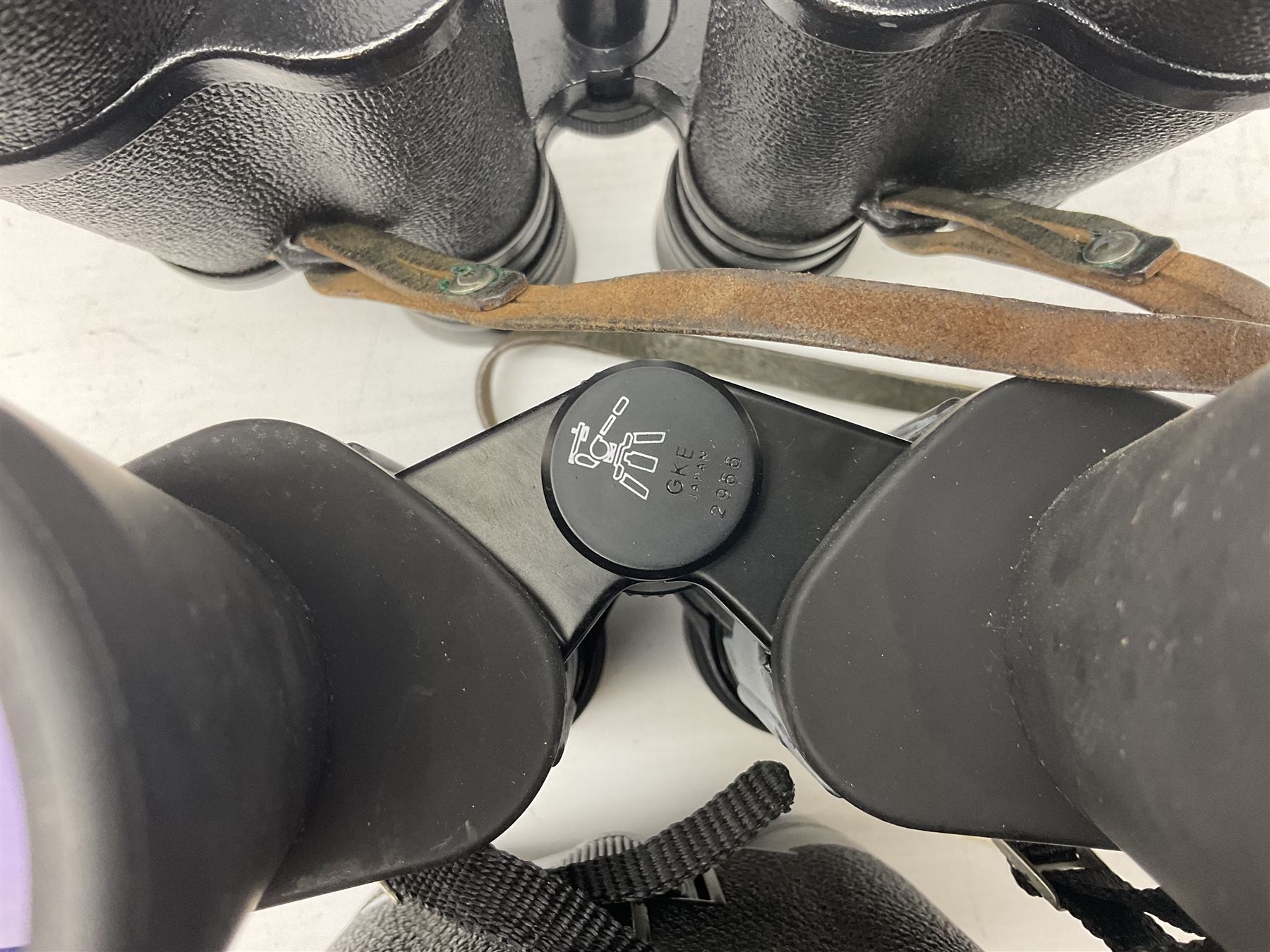 Eleven pairs of binoculars to include Lieberman & Gortz 20x65, Stem (USSR) 7x50, Helios 10x50 Field, Prinz 12x50, Tasco 8x40, Tasco 10x50, etc