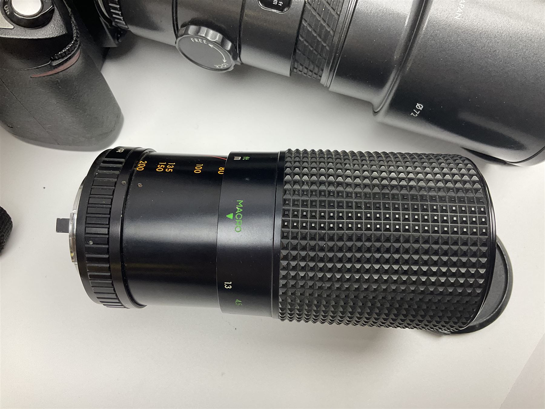 Four camera bodies, to include, Ricoh KR-10 serial no. 38826, Pentax MZ-M serial no. 4185969 with 'SMC Pentax- M 1:3.5 28mm' lens, Canon EOS500 serial no. 080927, with 'Sigma Zoom 100-300mm 1:4.5-6.7 DL'  lens etc, with other camera lenses and equipment 