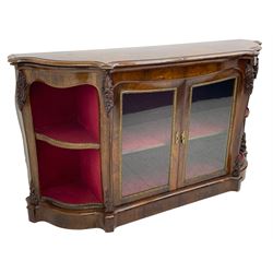 19th century rosewood buffet credenza, bombe form with shaped and moulded top, two central glazed doors with foliate moulded gilt slips, the red fabric-lined interior fitted with a single shelf, flanked by open shelves with raised gilt metal lips, the uprights decorated with shell and flower head carved cartouche mounts, acanthus leaf scroll carved lower mounts, on shaped and moulded plinth base 