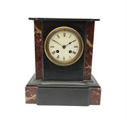 A Victorian Belgium slate mantle clock with a flat-topped breakfront case, with white veined rouge marble corners to the front and inserts, on a correspondingly shaped slate plinth, with a French eight-day striking movement striking the hours and half-hours on a bell, rack striking with a recoil escapement, white enamel dial with Roman numerals and steel spade hands within a flat bevelled glass and cast brass bezel, no pendulum or key.
