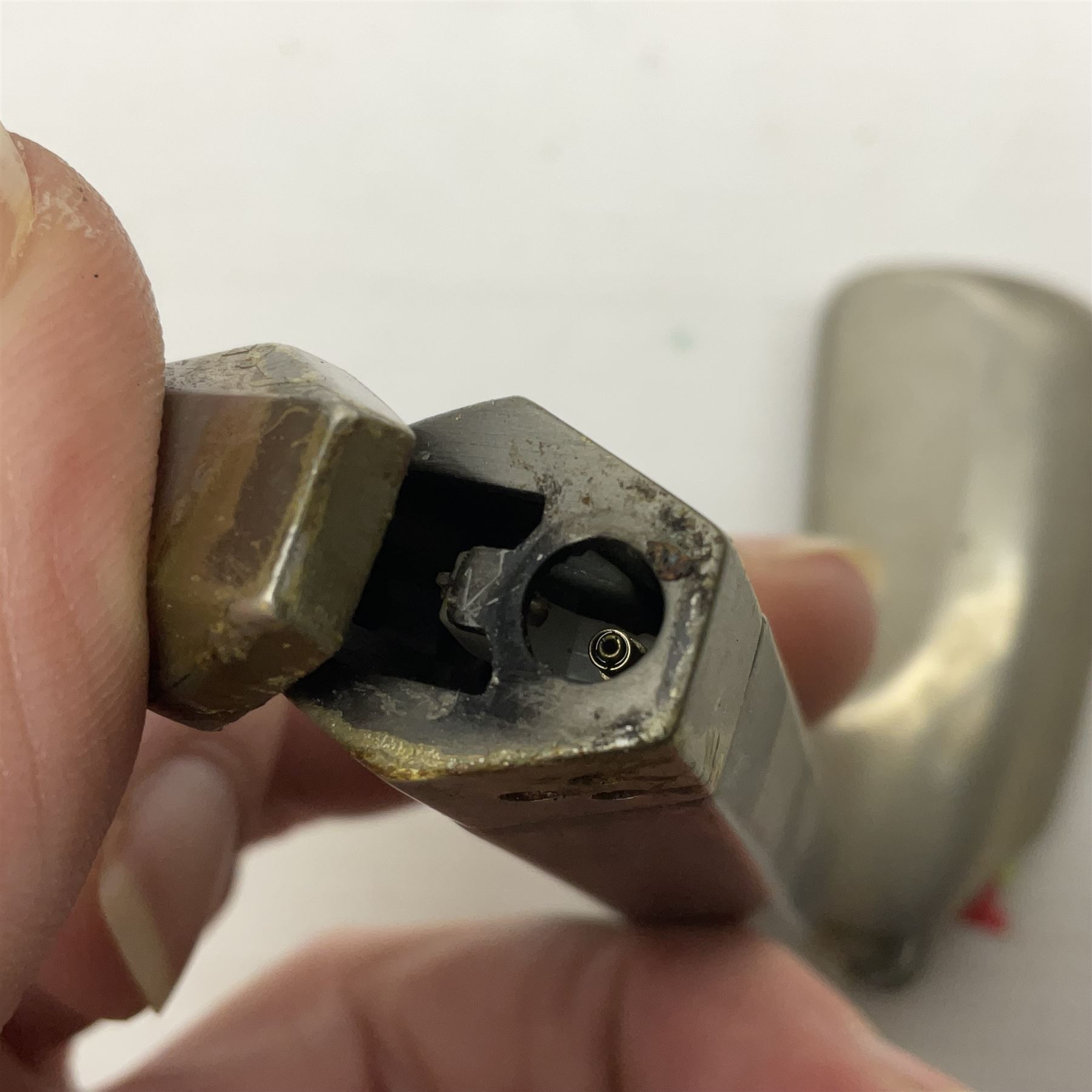 Collection of lighters, including Ronson Varaflame, Zorr Classic, Dunhill bark effect roller gas lighter, and faceted blue glass table lighter, etc