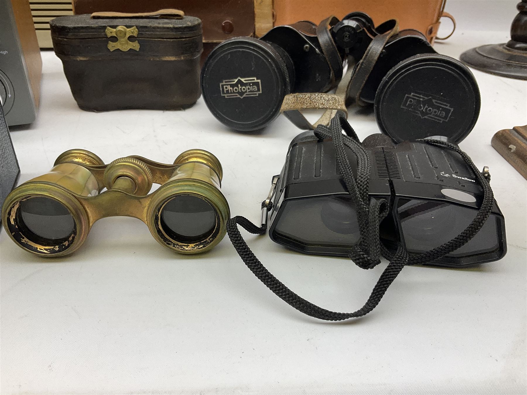 Pair of Rayswi of Harrogate carved oak candlesticks with brass mounts, in the form of an imp, together with a cased pair of Photopia binoculars, mother of pearl opera glasses, Bush radio, oak inkstand etc