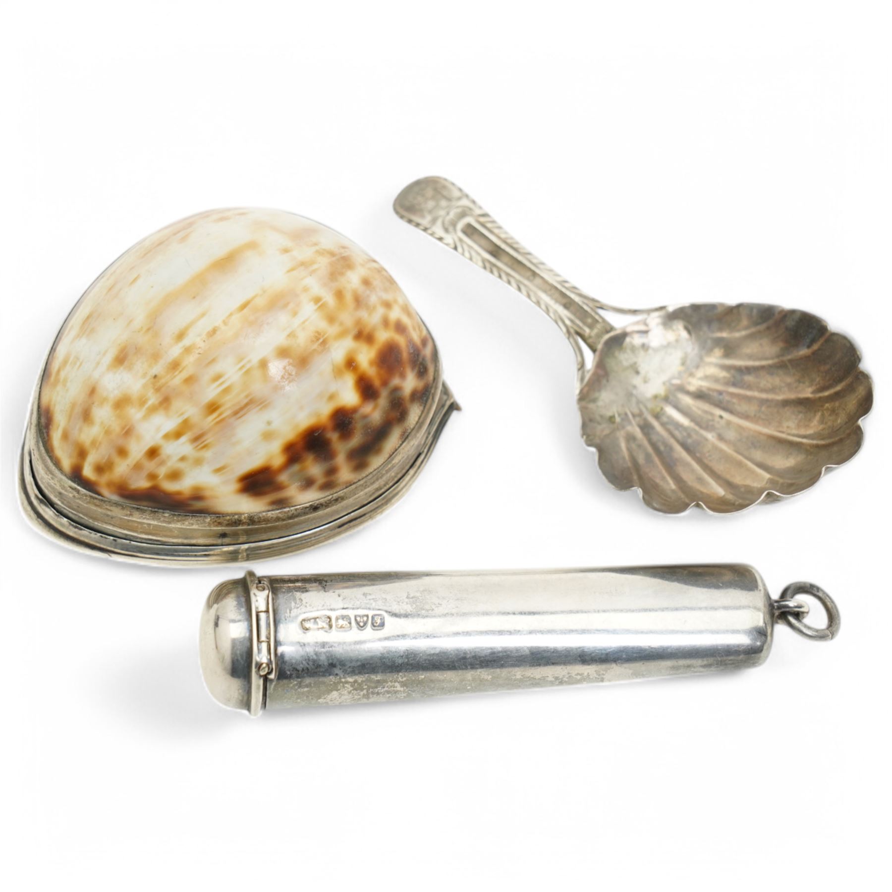 Early 19th century silver mounted cowrie shell snuff box with engraved decoration, George IV silver caddy spoon and a silver cheroot holder