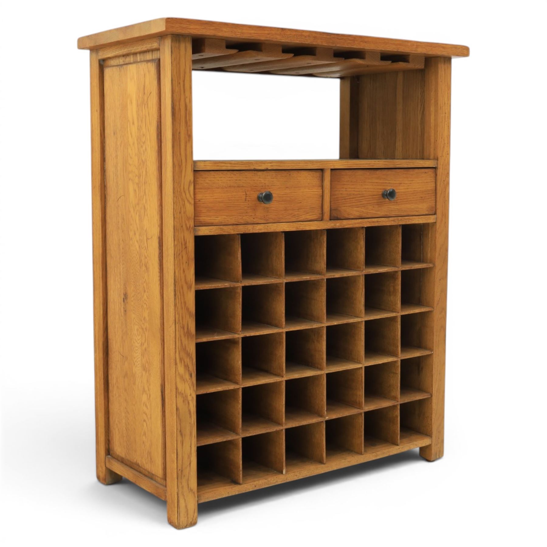 Traditional design light oak wine server, rectangular overhanging top above an open undertier with grooves for wine glasses, fitted with two drawers, lower section with open bottle racks for thirty five bottles, raised on square supports