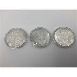Five United States of America 1oz fine silver one dollar coins, dated 1986, 1987, 1988, 1989 and 1990