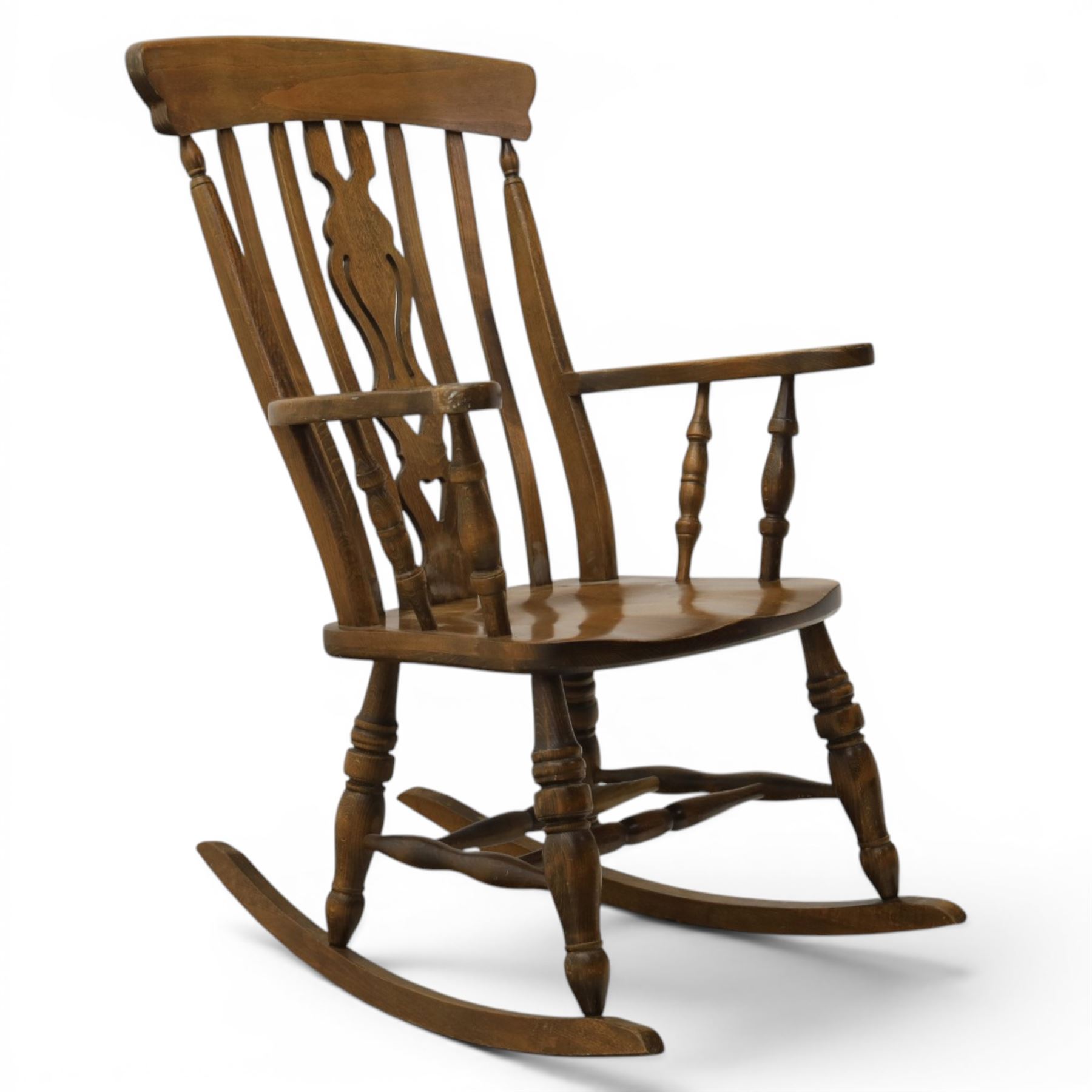Farmhouse elm rocking chair, high back with 'Fleur De Lis' splat, shaped arms above turned supports, on rocker base 